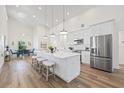 Bright and spacious kitchen with a large island, stainless steel appliances, and an adjacent dining area at 3860 Whiting Se Dr, St Petersburg, FL 33705