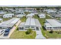 Wide aerial shot showcasing the mobile home, carport, and the surrounding mobile home community at 4618 Newcomb Ave, Zephyrhills, FL 33541