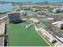 An aerial view of a waterfront community featuring multiple amenities, a marina, and stunning views at 7625 Sun Island S Dr # 407, South Pasadena, FL 33707