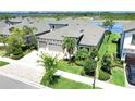 Gorgeous home with three car garage, mature landscaping, and a picturesque view at 14610 Red Castle Ave, Lithia, FL 33547