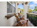 Relaxing front porch with comfortable wooden chairs, perfect for enjoying the outdoors at 216 N Habana Ave, Tampa, FL 33609