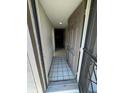 Welcoming hallway features neutral paint, tile floors, and recessed lighting at 3046 Eastland Blvd # J106, Clearwater, FL 33761