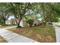 Well-maintained home with lush landscaping and mature trees at 402 Abigail Rd, Plant City, FL 33563