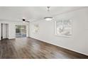 Bright living room featuring durable wood flooring and natural light at 402 Abigail Rd, Plant City, FL 33563