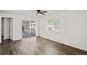 Spacious living room with sliding door access to the screened-in patio at 402 Abigail Rd, Plant City, FL 33563