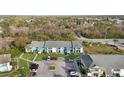 Community aerial showcasing well-manicured grounds, ample parking, and vibrant blue accents at 455 Alt 19 S Hwy # 81, Palm Harbor, FL 34683
