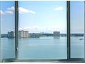 Breathtaking water view framed by a large window showcasing the city skyline in the distance at 6372 Palma Del Mar S Blvd # 1007, St Petersburg, FL 33715