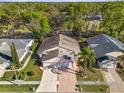 Aerial view of home showcasing its position surrounded by mature trees and landscaping at 13526 Norman Cir, Hudson, FL 34669