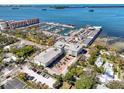 Stunning aerial view of condo community, showcasing marina, waterfront, and convenient parking at 200 Main St # 202, Dunedin, FL 34698