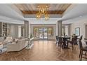 Lobby with herringbone floors, modern lighting, neutral decor and comfortable seating at 200 Main St # 202, Dunedin, FL 34698