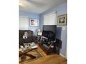 Cozy living room with a comfortable couch, modern TV, and decorative artwork, great for relaxation at 2222 Harper St, Tampa, FL 33605
