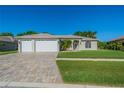 Charming home featuring a well-manicured lawn and lovely curb appeal at 3720 Gaviota Dr, Ruskin, FL 33573