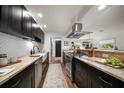 Beautiful gourmet kitchen with stainless appliances, custom cabinets and granite countertops for cooking and entertaining at 409 Erie Ave, Tampa, FL 33606