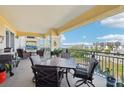 Spacious balcony with comfortable seating offers water views, perfect for outdoor dining and relaxation at 700 N Osceola Ave # 504, Clearwater, FL 33755