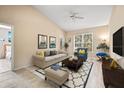 Cozy living room featuring bright natural light, comfortable seating and neutral decor at 10115 Courtney Palms Blvd # 202, Tampa, FL 33619