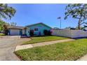 Lovely home with a neatly manicured lawn, charming landscaping, and a welcoming pathway at 11492 60Th Lane, Pinellas Park, FL 33782