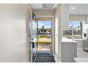 Bright and airy entryway featuring stylish tile floors and views of the beautiful waterfront at 19029 Us Highway 19 N # 21E, Clearwater, FL 33764