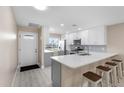 Modern kitchen featuring white cabinets, quartz countertops, and stainless steel appliances at 19029 Us Highway 19 N # 21E, Clearwater, FL 33764