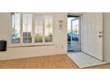 Bright entryway with natural light, wood floors, and white trim at 2263 Fluorshire Dr, Brandon, FL 33511