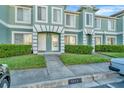 Townhouse complex showcasing well-manicured lawns, with a view of the parking at 2263 Fluorshire Dr, Brandon, FL 33511