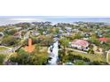 Aerial view showcases waterfront homes, boat docks, and lush tropical landscaping at 2632 S Dundee St, Tampa, FL 33629