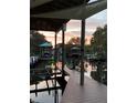 Scenic view of a dock with a hammock, boat lifts, and a beautiful sunset at 2632 S Dundee St, Tampa, FL 33629