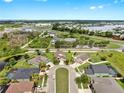 Wide aerial shot of the neighborhood near main roads, water features, and neatly arranged homes at 5324 Moon Shell Dr, Apollo Beach, FL 33572