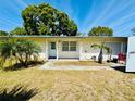 Charming single-story home featuring a cozy front porch and well-manicured lawn at 619 41St Ne Ave, St Petersburg, FL 33703