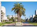 Welcoming entrance to Coral Pointe with lush landscaping and a clear view of the well maintained complex at 8020 Sailboat Key S Blvd # 404, St Pete Beach, FL 33707
