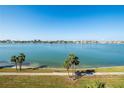 Scenic water view from the property, capturing the serene waterfront with calm blue water and cityscape at 8020 Sailboat Key S Blvd # 404, St Pete Beach, FL 33707