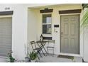 Charming front door entrance with stylish decor and a well-kept exterior at 11944 Miracle Mile Dr, Riverview, FL 33578