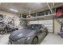 Spacious garage featuring a gray car, motorcycle, and ample overhead storage racks for organization at 146 4Th Ne Ave # 600, St Petersburg, FL 33701