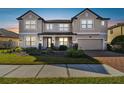 Inviting two-story home with an attached two-car garage and beautiful brick driveway at 19432 Whispering Brook Dr, Tampa, FL 33647