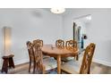 Dining area features a wooden table with ornate chairs and bright overhead lighting at 2348 Shelley St # 8, Clearwater, FL 33765