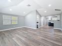 Bright, airy living room with vaulted ceilings and new vinyl flooring, showcasing open concept design at 3755 10Th S Ave, St Petersburg, FL 33711