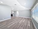 Spacious living room with modern finishes, vinyl plank flooring, and natural light at 3755 10Th S Ave, St Petersburg, FL 33711