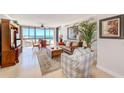Bright living room featuring ocean views, comfortable seating, and tasteful decor at 3820 Gulf Blvd # 802, St Pete Beach, FL 33706
