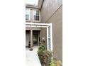 Charming townhouse exterior with well-maintained landscaping and stucco walls at 4133 Bismarck Palm Dr, Tampa, FL 33610