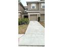 Charming townhouse exterior with well-maintained landscaping at 4133 Bismarck Palm Dr, Tampa, FL 33610