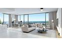 Bright, modern living room with floor-to-ceiling windows offering panoramic city views at 520 N Tampa St # 1906, Tampa, FL 33602