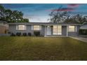Charming single-story home with well-maintained lawn and exterior, creating a welcoming ambiance at 6712 Runningwoods Dr, Tampa, FL 33634