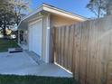A well-maintained one car garage and partial privacy fence for security at 7126 Oelsner St, New Port Richey, FL 34652