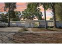 Charming single-story home with manicured lawn and colorful sunset at 766 86Th N Ave, St Petersburg, FL 33702