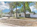 Inviting single-story home with mature trees at 766 86Th N Ave, St Petersburg, FL 33702