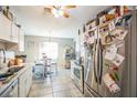 Bright kitchen featuring stainless steel appliances, white cabinets, and a cozy breakfast nook at 10352 Lansfield St, Spring Hill, FL 34608