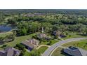 Gorgeous aerial view of home near lake and golf course at 13551 Carnoustie Cir, Dade City, FL 33525