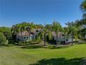 Beautiful one-story home with a tile roof and lush landscaping at 13551 Carnoustie Cir, Dade City, FL 33525