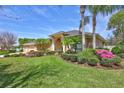 Beautiful single-story home boasting lush landscaping, a well-maintained lawn, and a welcoming facade at 2905 Hillside Ramble Dr, Brandon, FL 33511