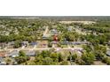 A neighborhood view with mature trees and a red location pin marking the property's location in the community at 3276 Morven Dr, Spring Hill, FL 34609