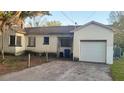 View of the rear exterior of the house with a garage and driveway at 525 36Th Ne Ave, St Petersburg, FL 33704